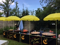 traiteur paella géante dehors dans votre jardin